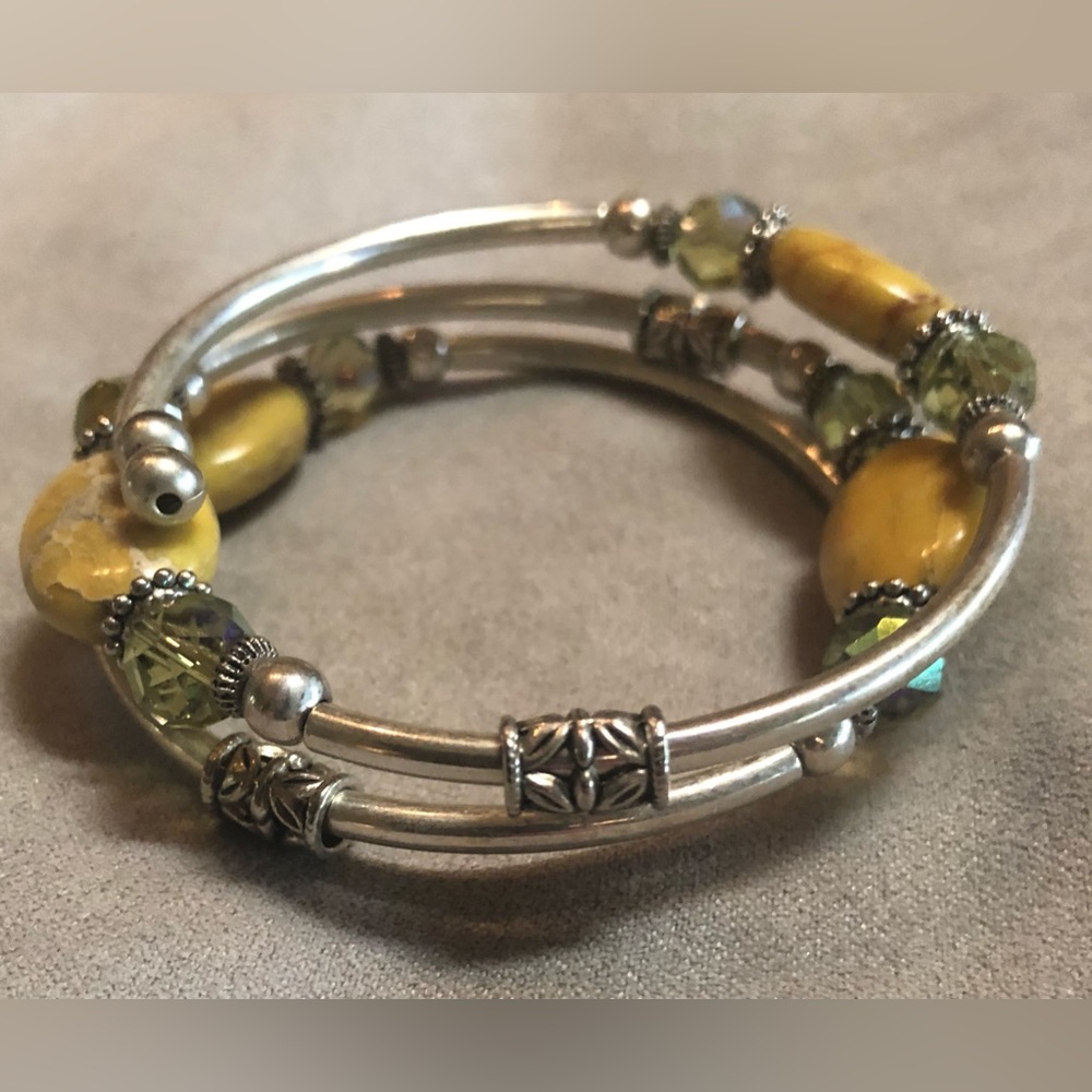 Gorgeous yellow and silver tone wrap bracelet.